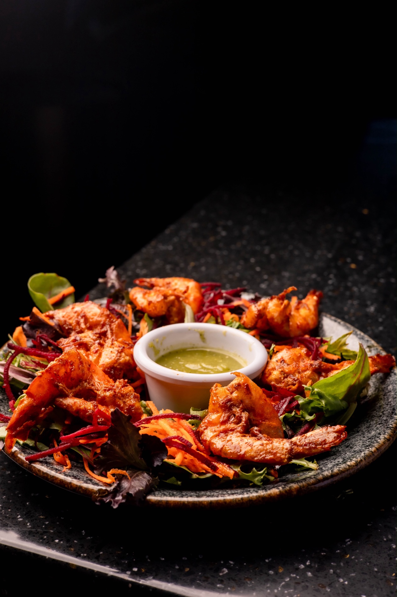 Spiced shrimp platter with greens and salsa verde